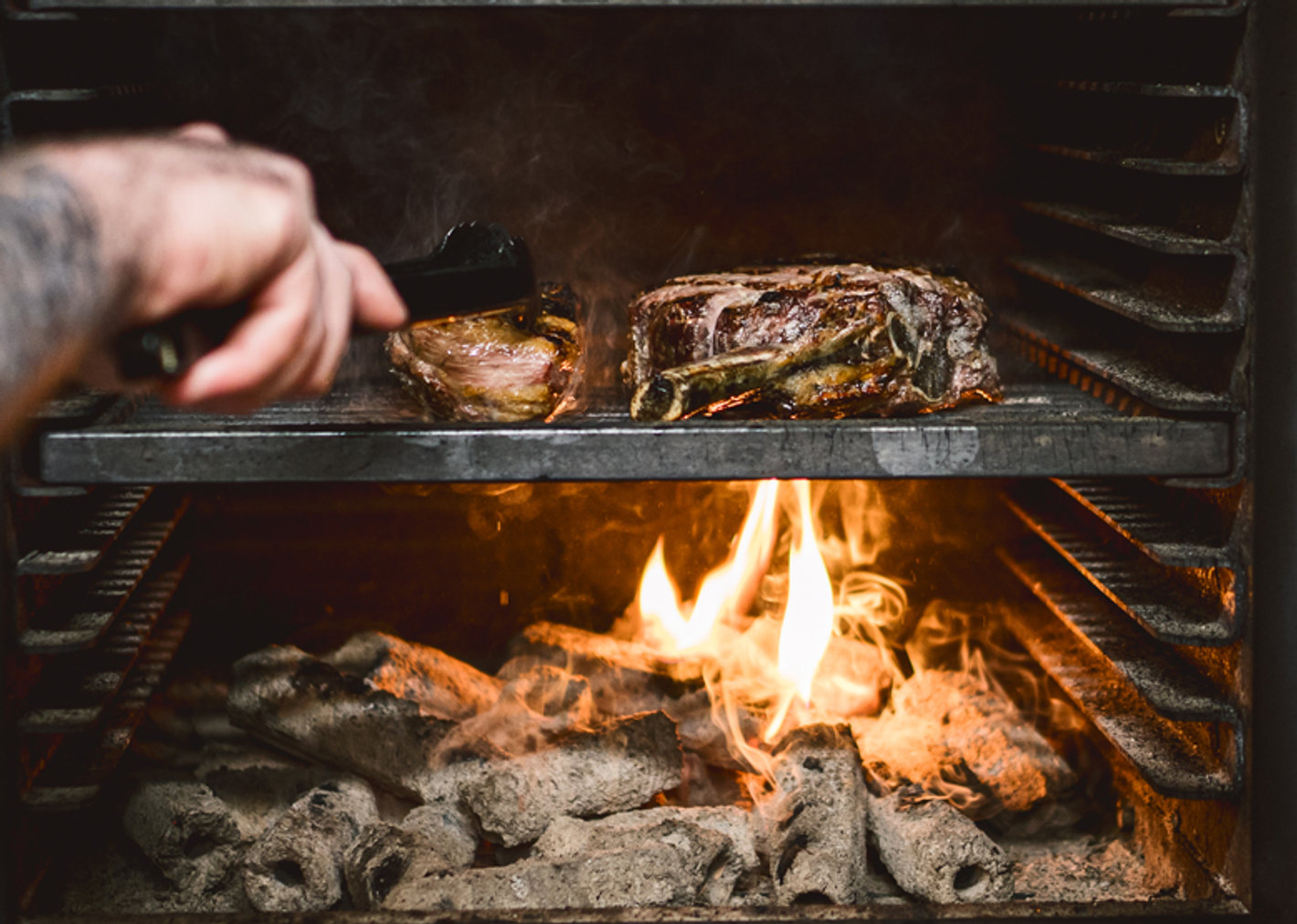 Meat cooking over the charcoal fire