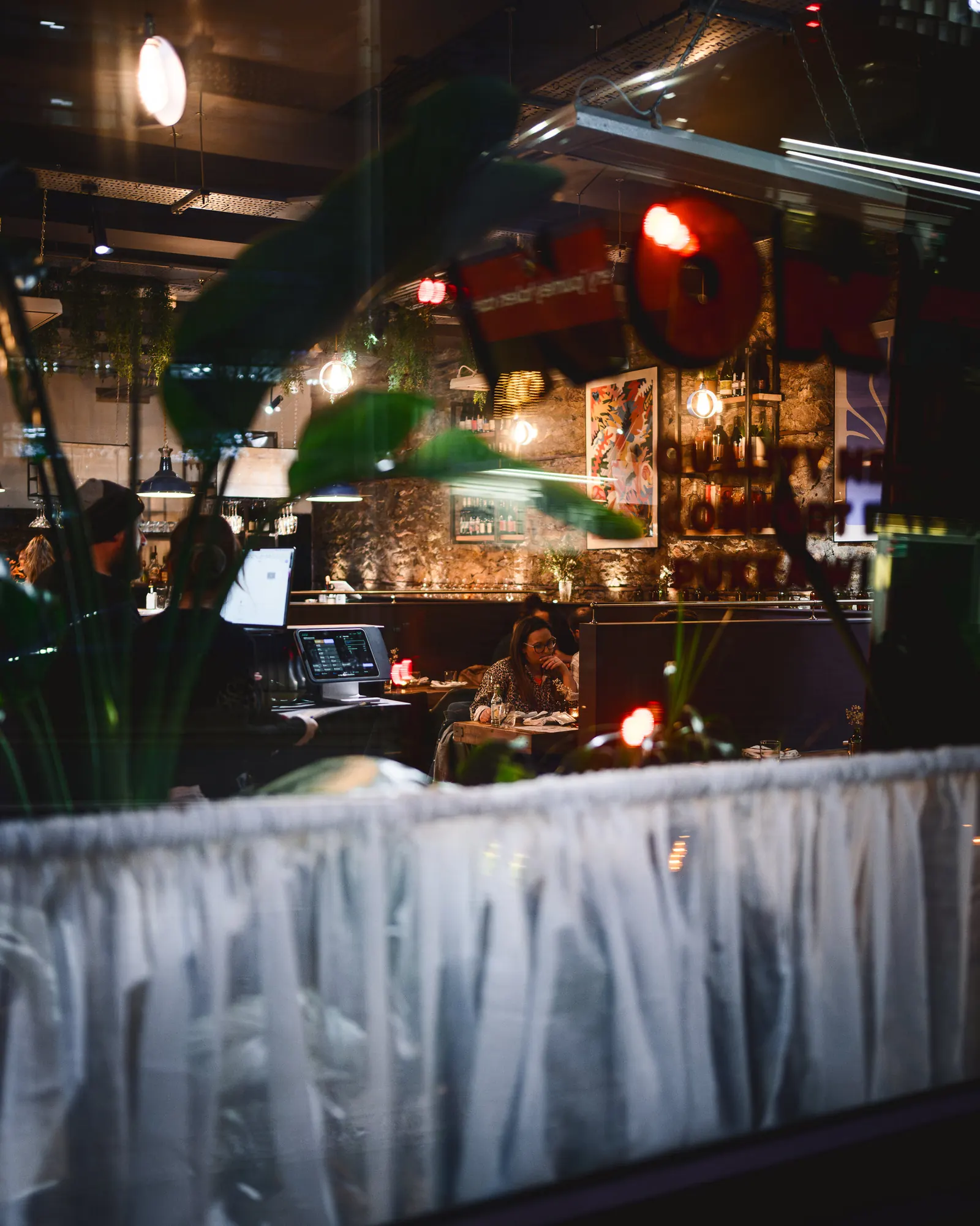 View through the restaurant to the open kitchen at NORA'S
